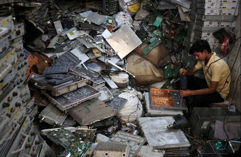 A worker dismantles electronic waste at a workshop in New Delhi on June 5, 2018. (REUTERS File Photo)